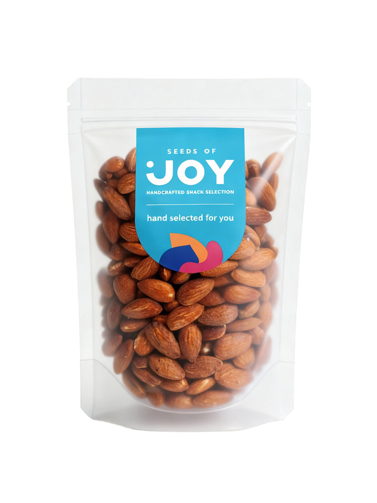 Seeds of Joy Smoked Almonds front packaging. Hand selected for you. Perfect for a cheese board!
