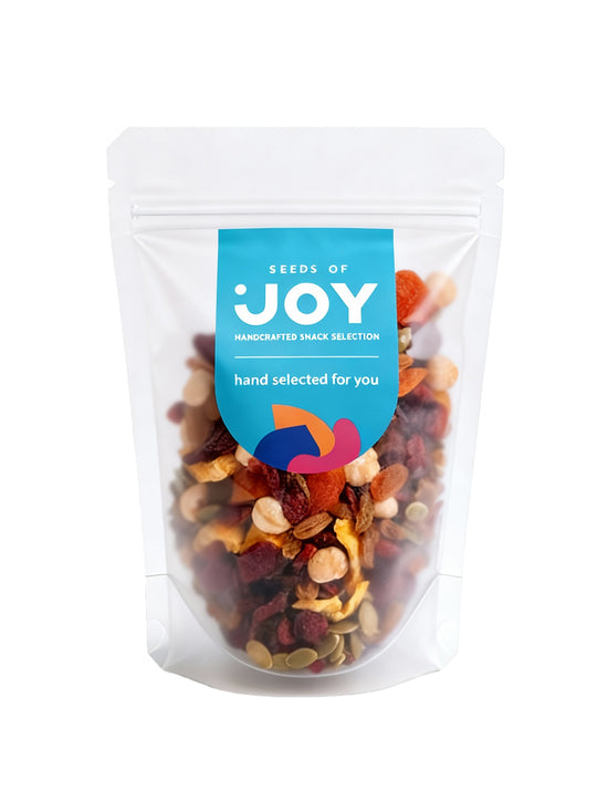 Seeds of Joy Fruity Mix front packaging. The perfect mix of Apricot, Dried Cranberries, Green Raisins, Hazelnuts, Green Melon Seeds, Preserved Guava. Hand selected for you.