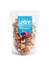Seeds of Joy Natural Deluxe Mix front packaging. An energising snack or something to support your well-being throughout the day. Hand selected for you!