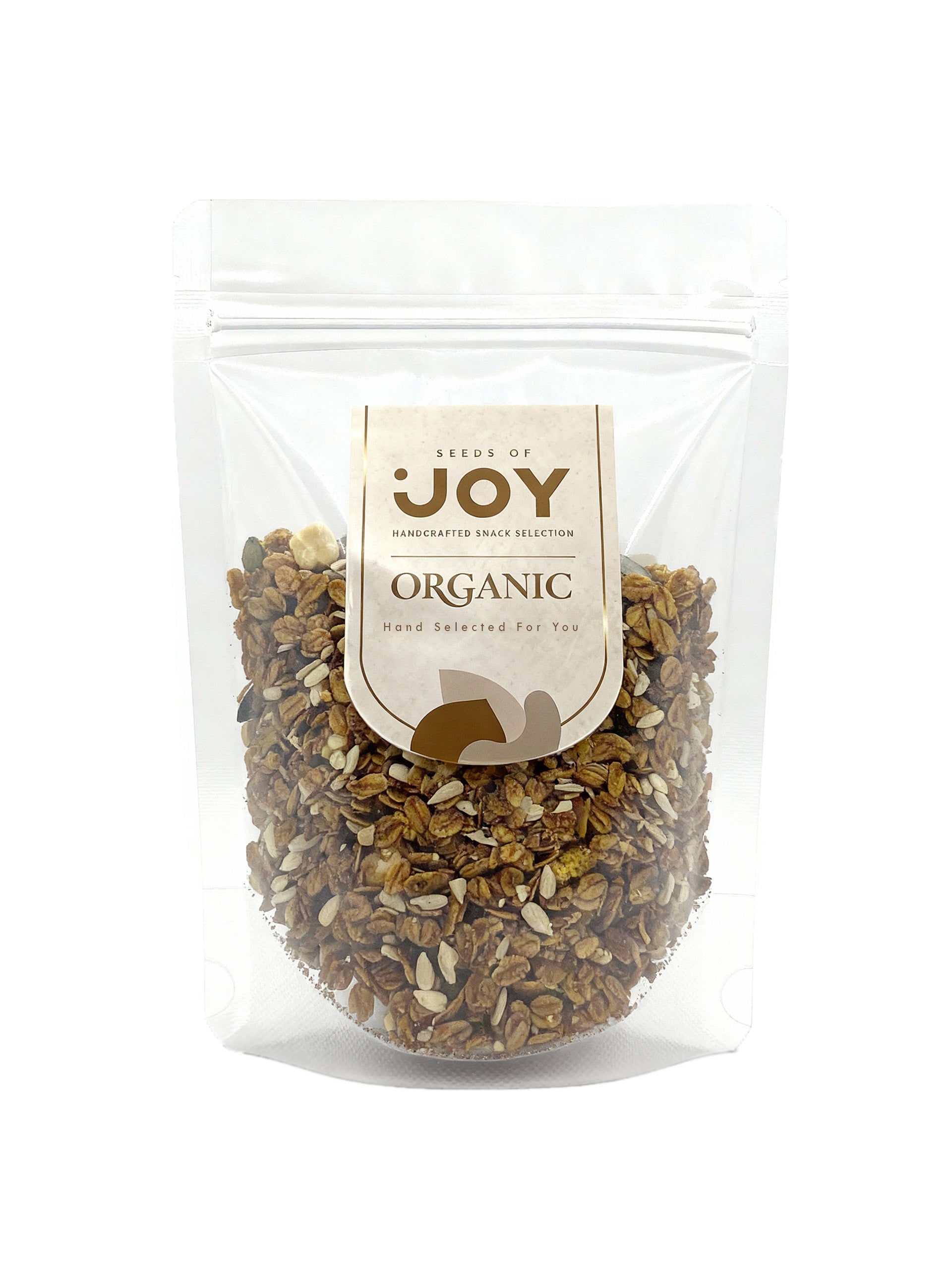 Seeds of Joy Organic Dark Hazelnut Granola front packaging. Hand selected for you. Delicious! Top your morning yogurt with it.
