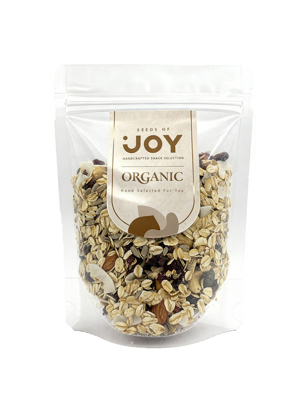 Seeds of Joy Organic Luxury Muesli with 50% Nuts and Fruits front packaging. Hand selected for you. Perfect for topping you breakfast yogurt.